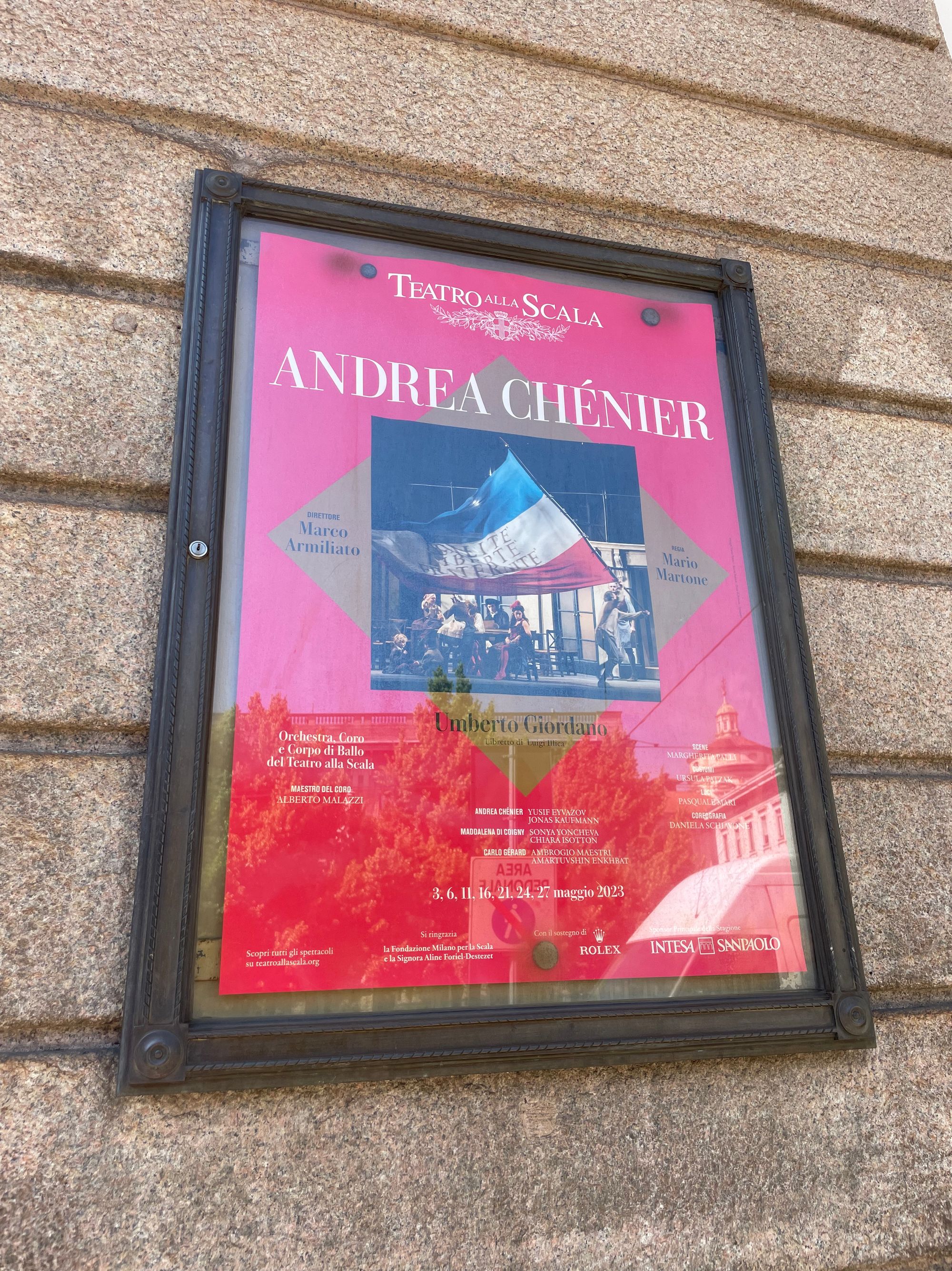 The poster for Umberto Giordano's opera Andrea Chénier on the wall of la Scala opera house